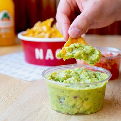Nachos and guacamole to share in a Mexican restaurant
